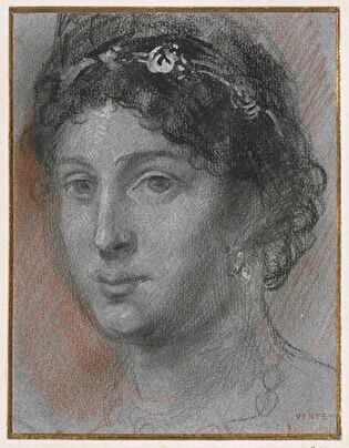 Head of a woman with hair pinned up and tied with a ribbon