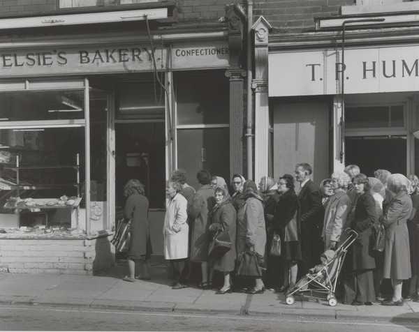 People queuing outside of bakery during flour shortage (‘the bread strike’)