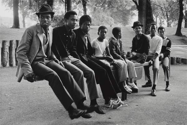 Young men on a seesaw in Handsworth Park