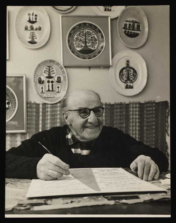 ‘Black and white photograph of Scottie Wilson in his Kilburn flat