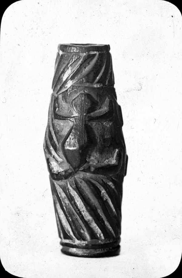 ‘Black and white glass lantern slide of a picture of a vase, possibly from Africa, carved with the shape of a turtle and geometric lines