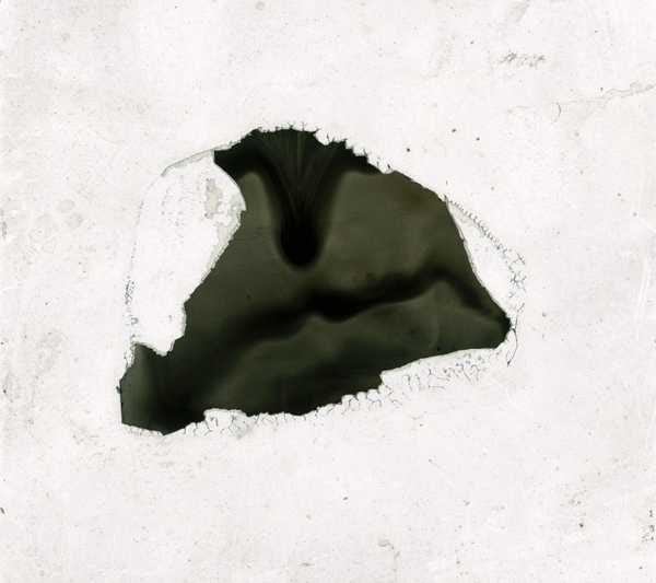 ‘Glass slide with a piece of black paper, possibly cut from a negative, glued in the middle