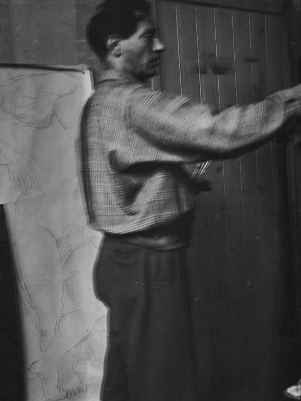 ‘Black and white negative of Duncan Grant seen in profile, painting indoors at Charleston, Firle, Sussex