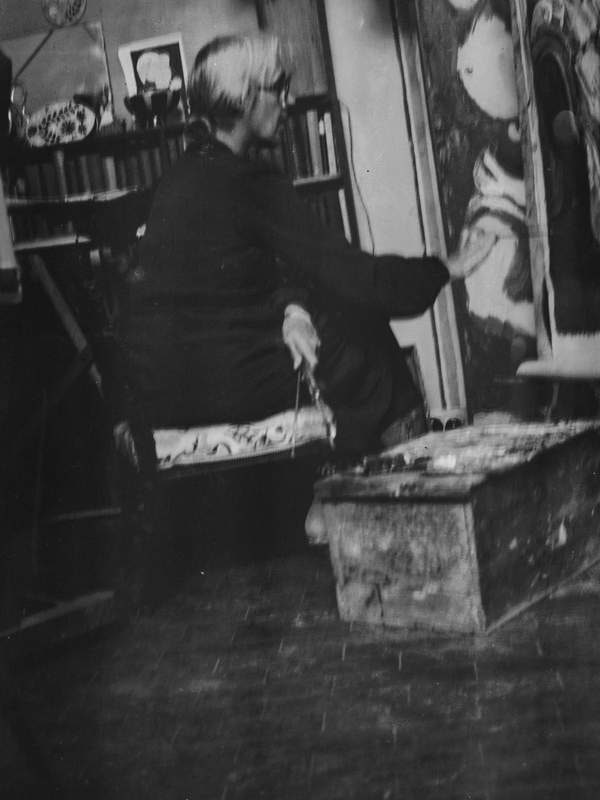 ‘Black and white negative of Vanessa Bell painting in the studio at Charleston, Firle, Sussex