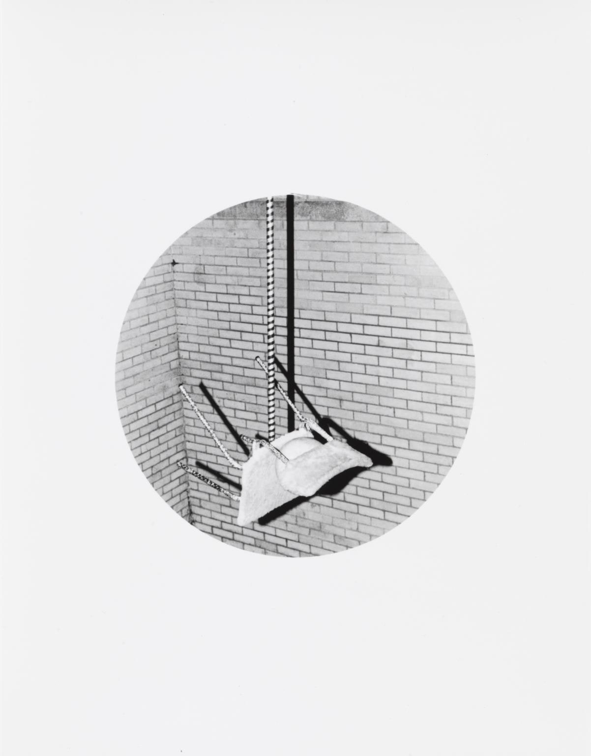 Untitled (Chair balancing on stick)