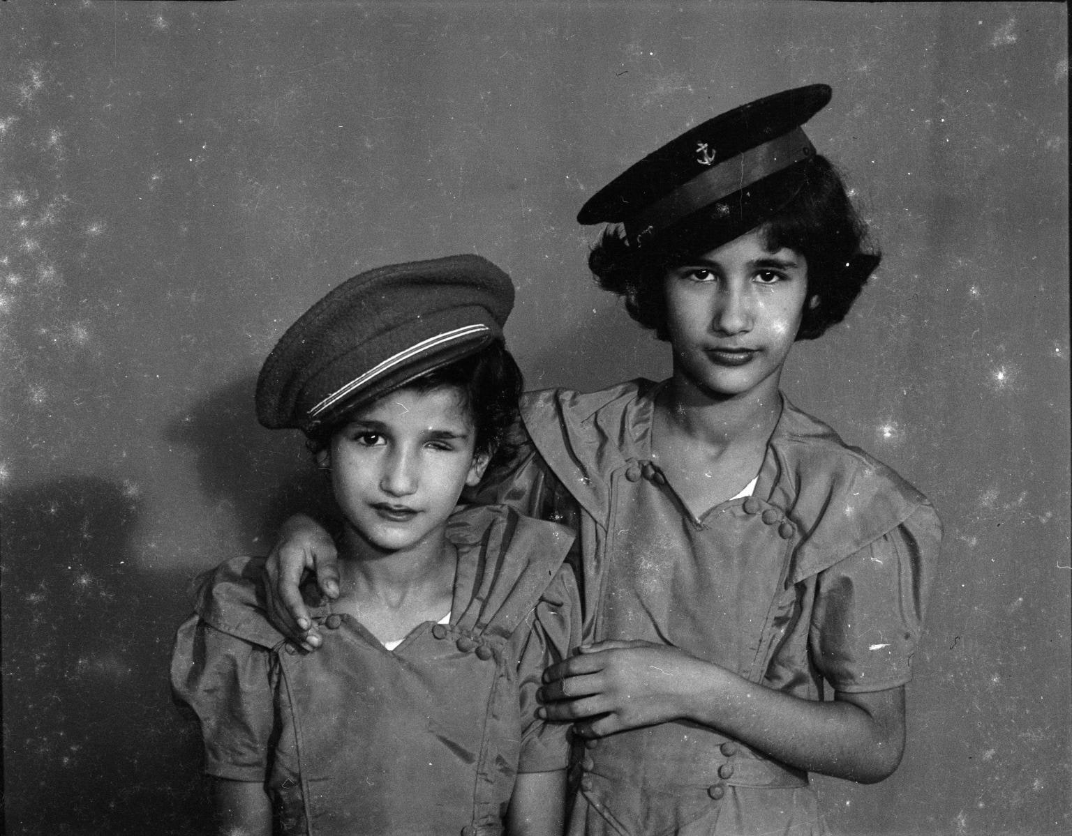 Two Palestinian sisters. Studio Shehrazade, Saida, Lebanon, 1960s. Hashem el Madani
