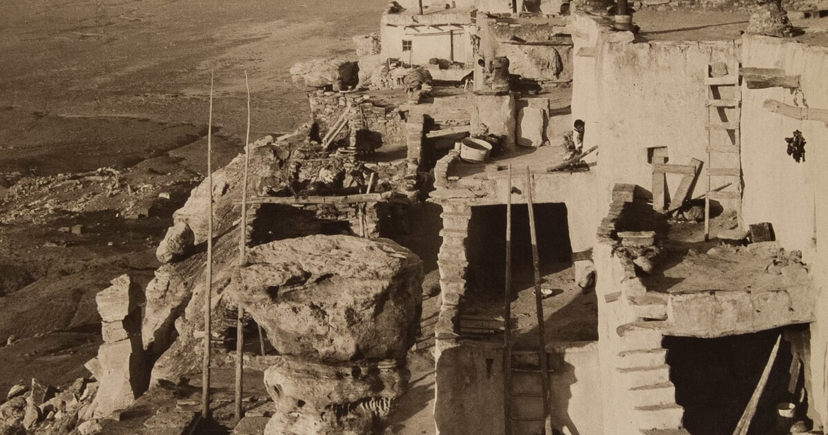 [Overview of Indian pueblo high atop mesa]