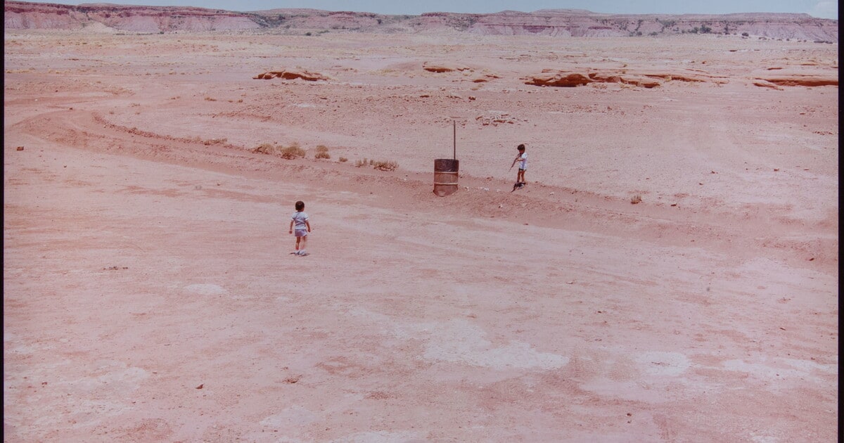 Navajo Boys Shooting Bottles near Tuba City, Arizona, 1984