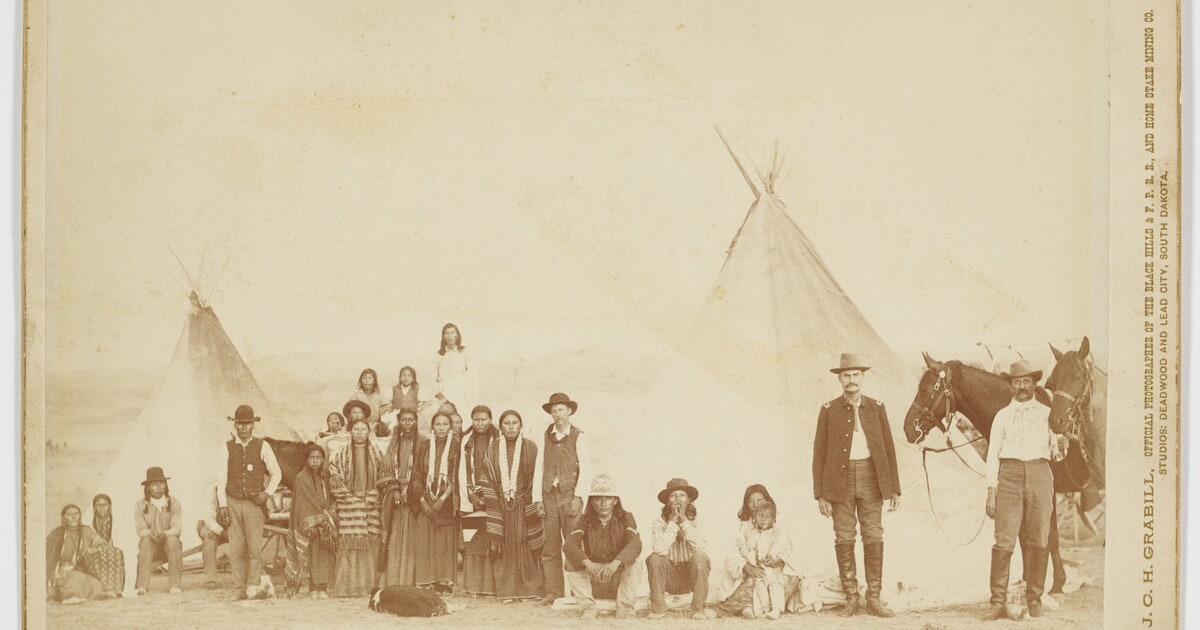 [Group of Native Americans with soldiers and tipis]