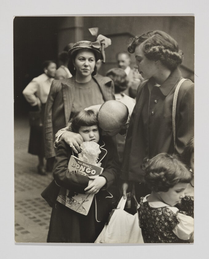 Father hugging young girl at Penn Station, New York City