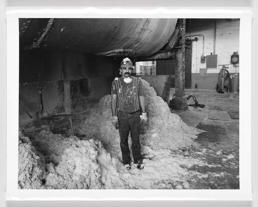 José Cumba under the boiler where rags are bleached at Parsons Paper Company, Holyoke, Massachusetts