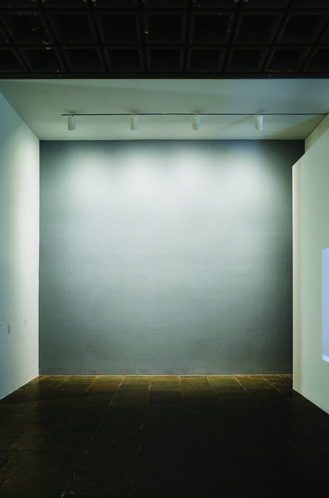 Wall Drawing #228: White Circles, Grids and Arcs from Two Opposite Sides of a Gray Wall