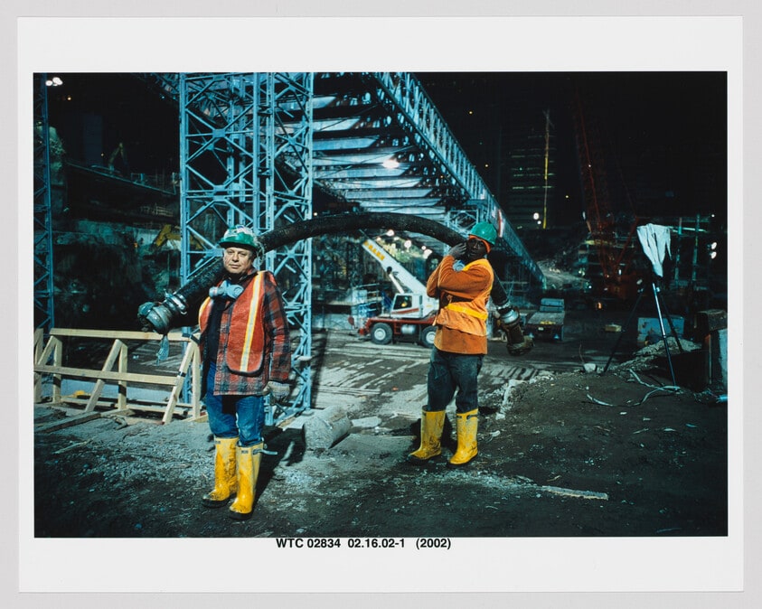 Workers Carrying Pipe