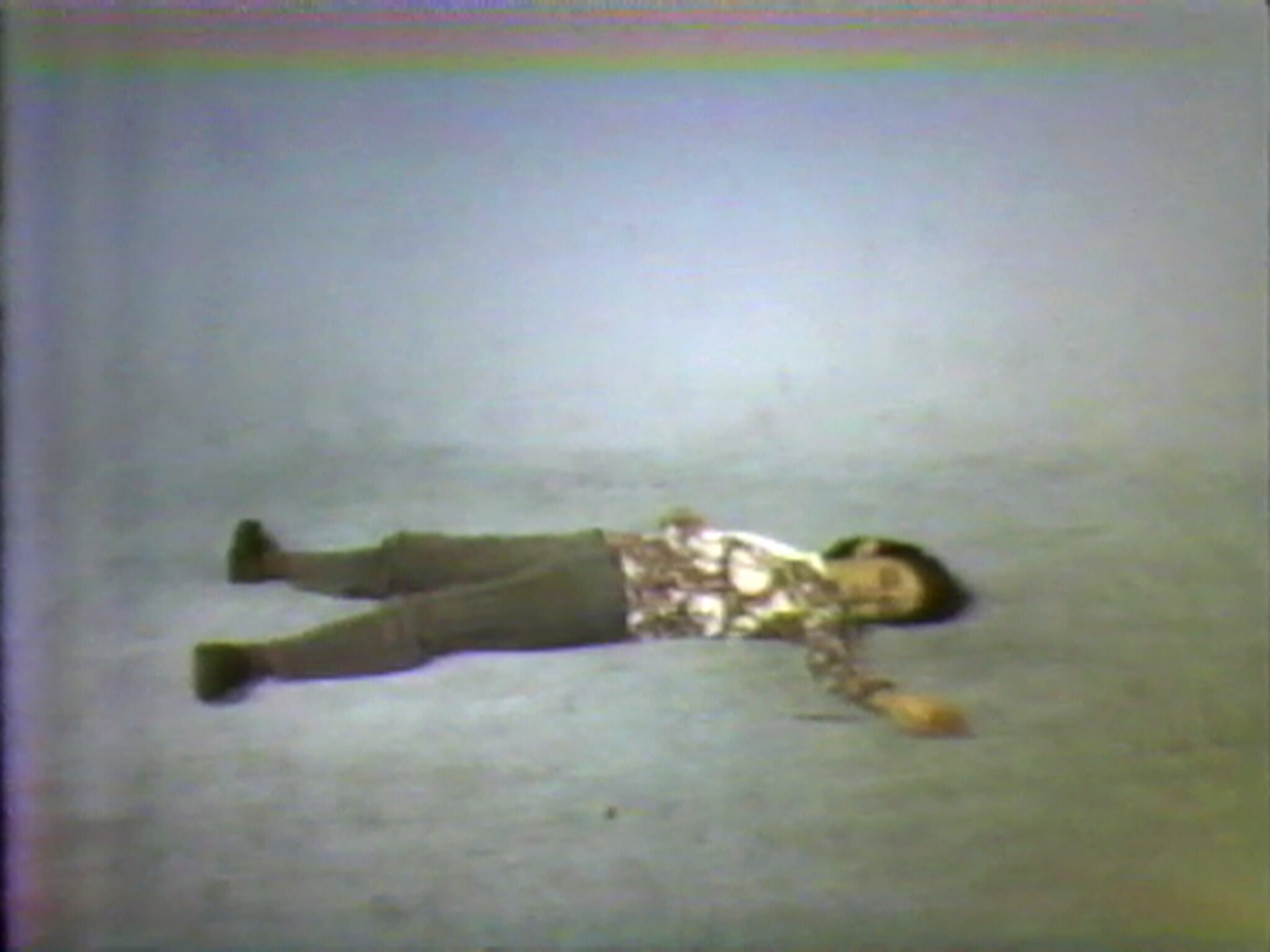 Elke Allowing the Floor to Rise Up Over Her, Face Up