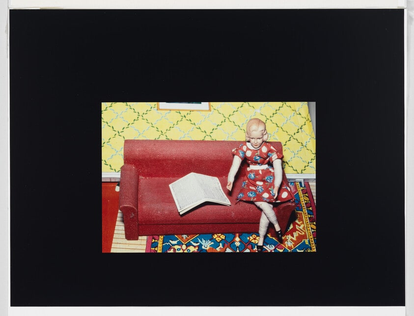Woman/Red Couch/Newspaper