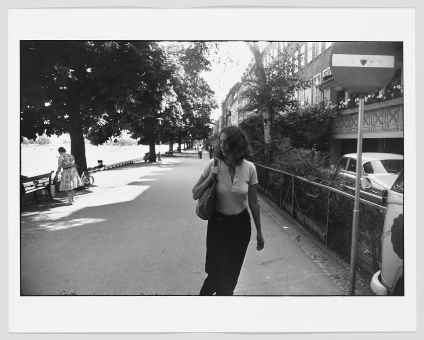 Woman Walking Along Quay