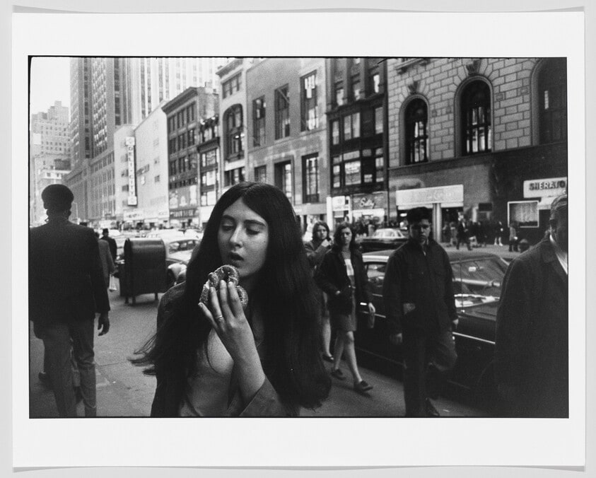 Young Woman Eating a Pretzel