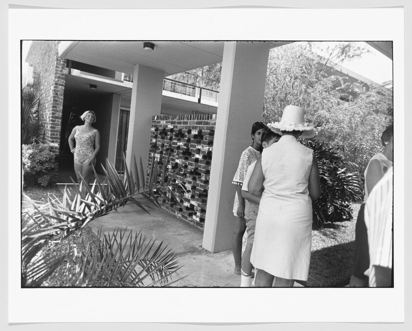 Woman in Bathing Suit Leaving a Motel