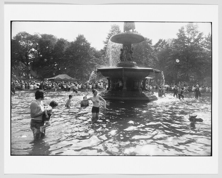 Woman in Fountain Throwing Ball