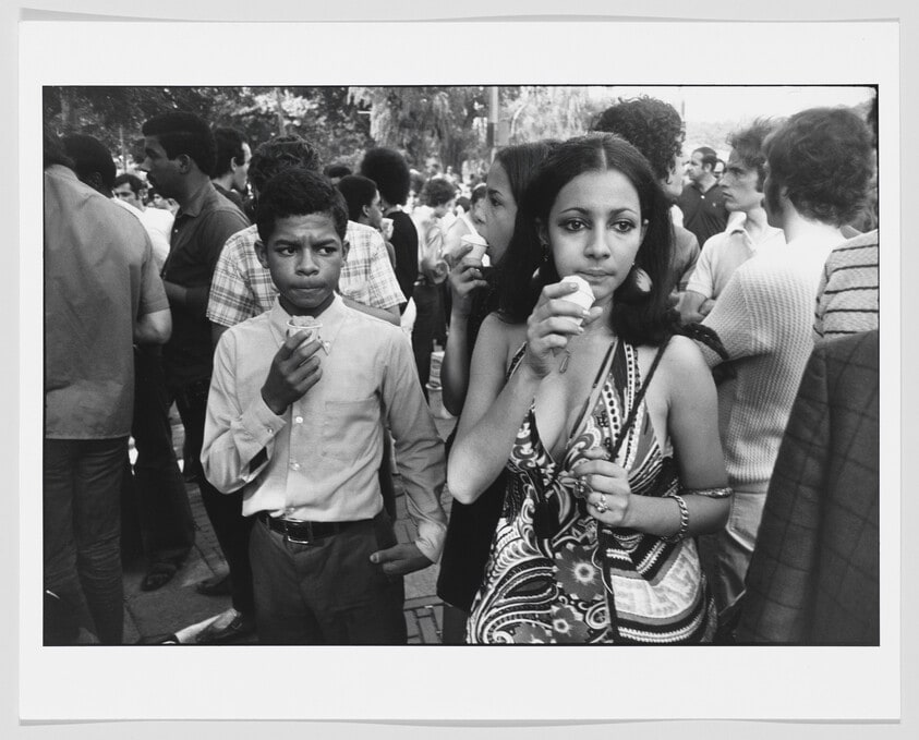 Young Woman and Young Black Man Eating Icies