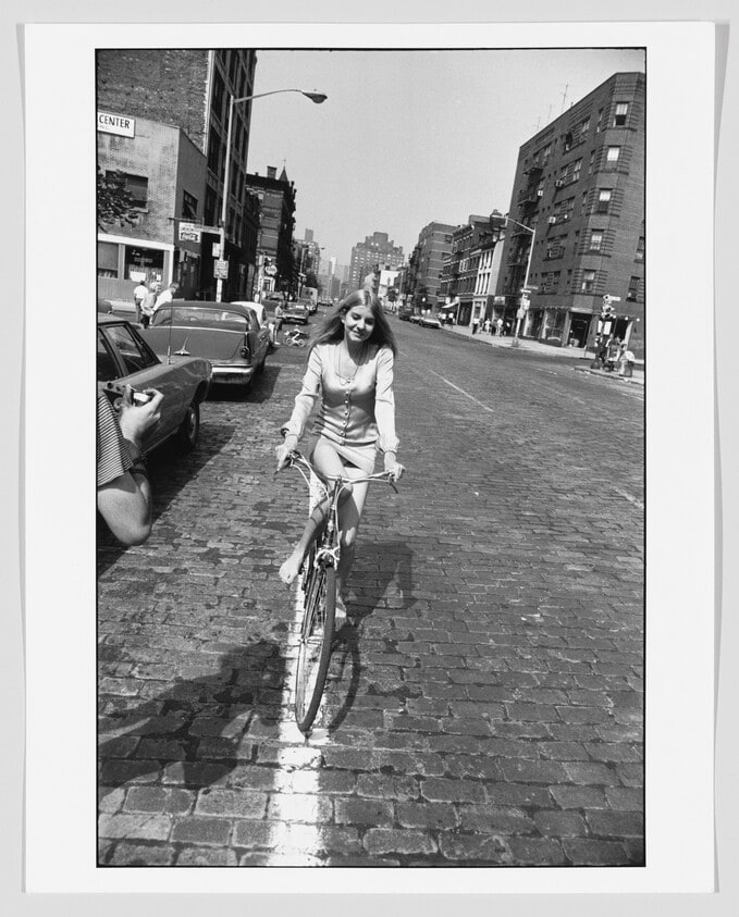 Young Woman Riding Bicycle