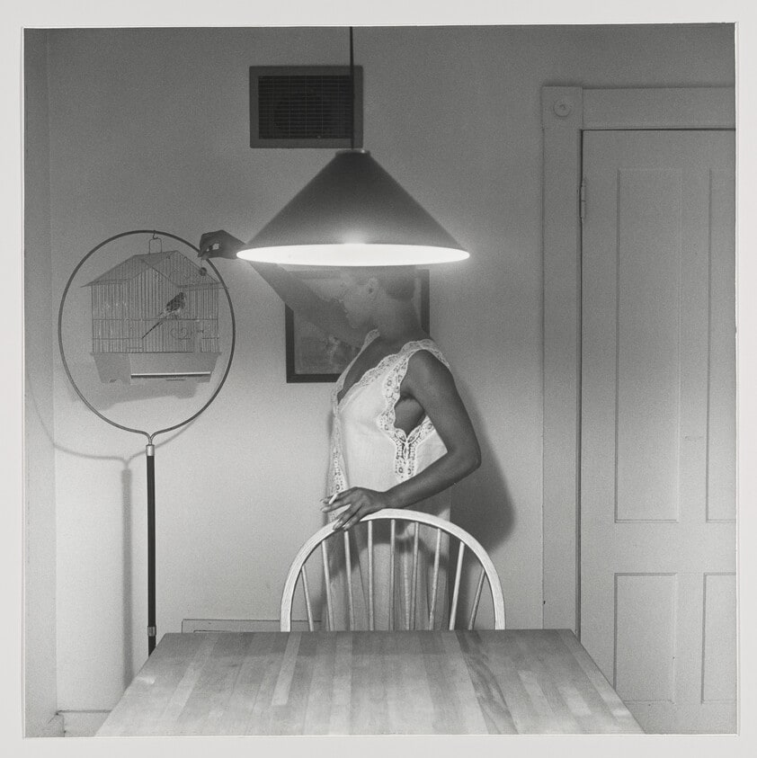 Untitled (woman feeding bird)
