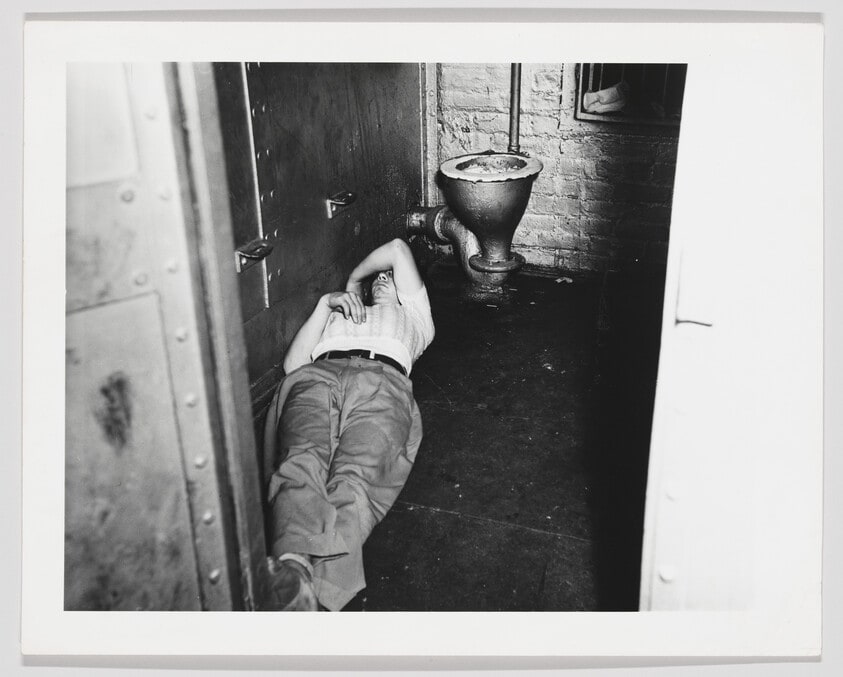Untitled (Man sleeping in basement)