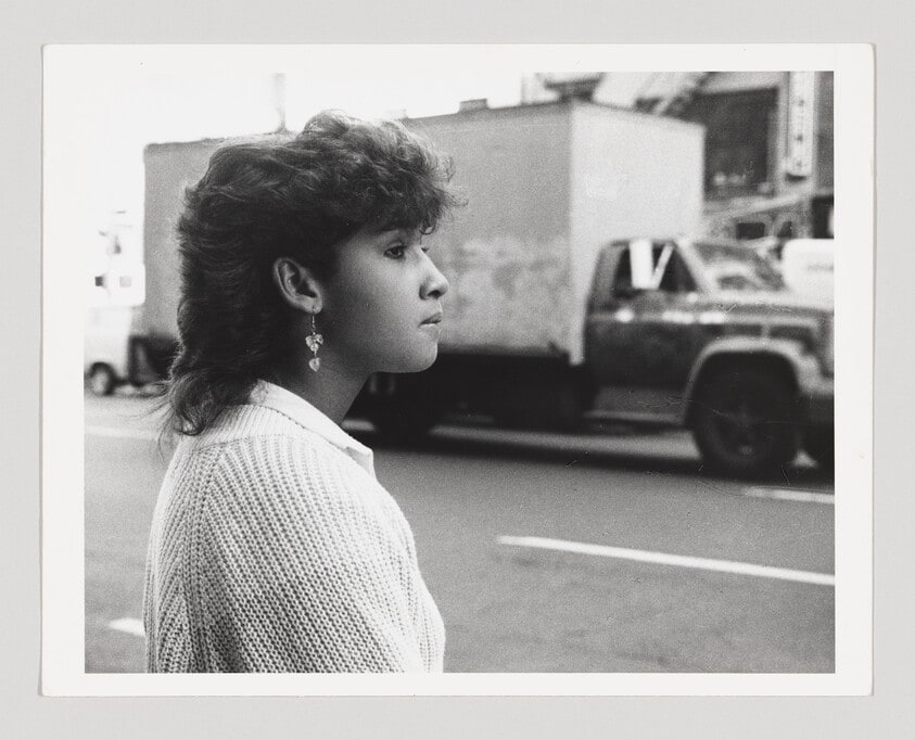 Untitled, New York (woman in white sweater, truck in background)