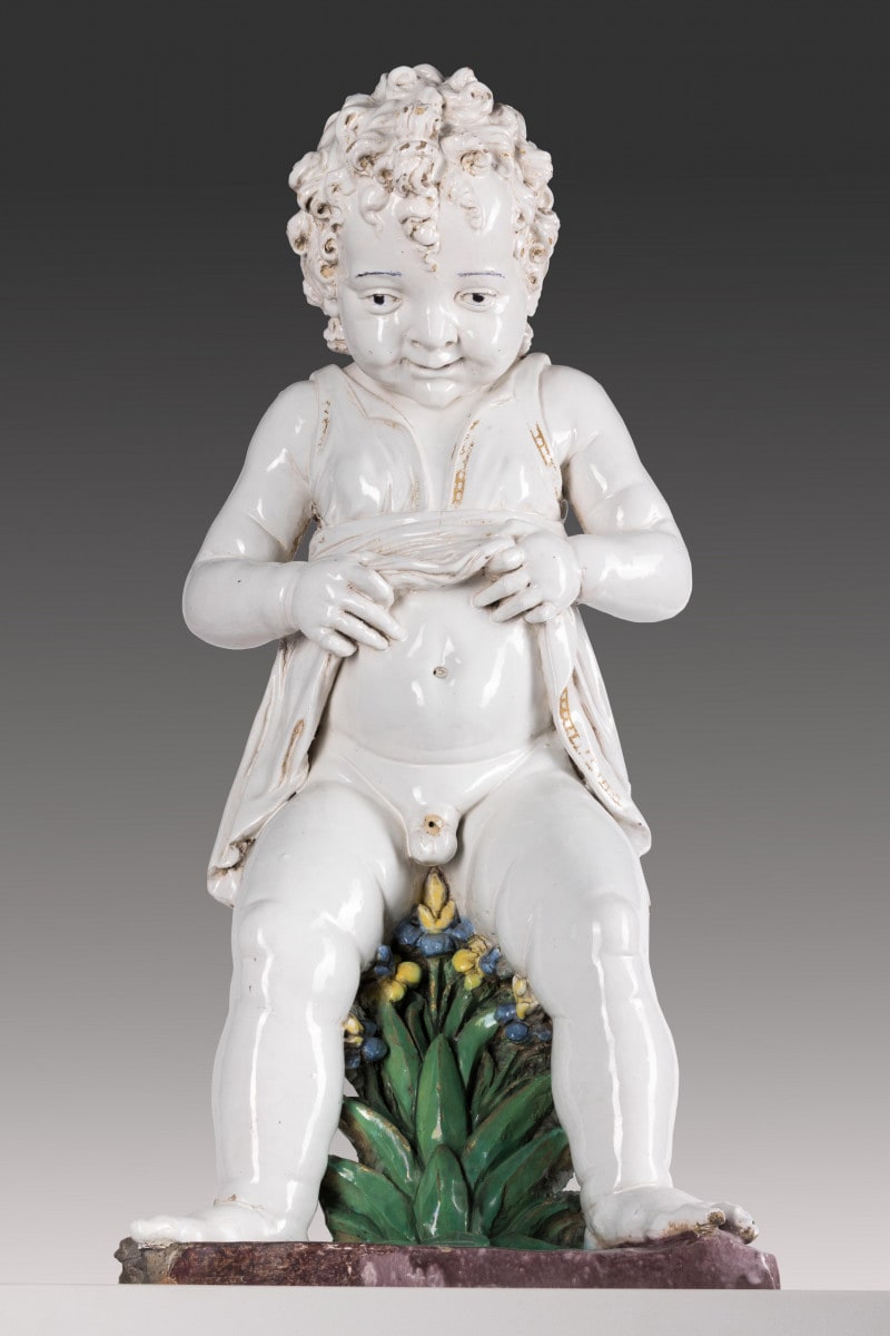 Pinkelnder Knabe als Brunnenfigur