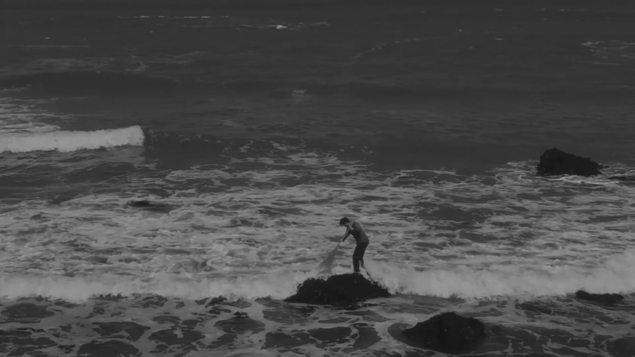 A person cleaning waves