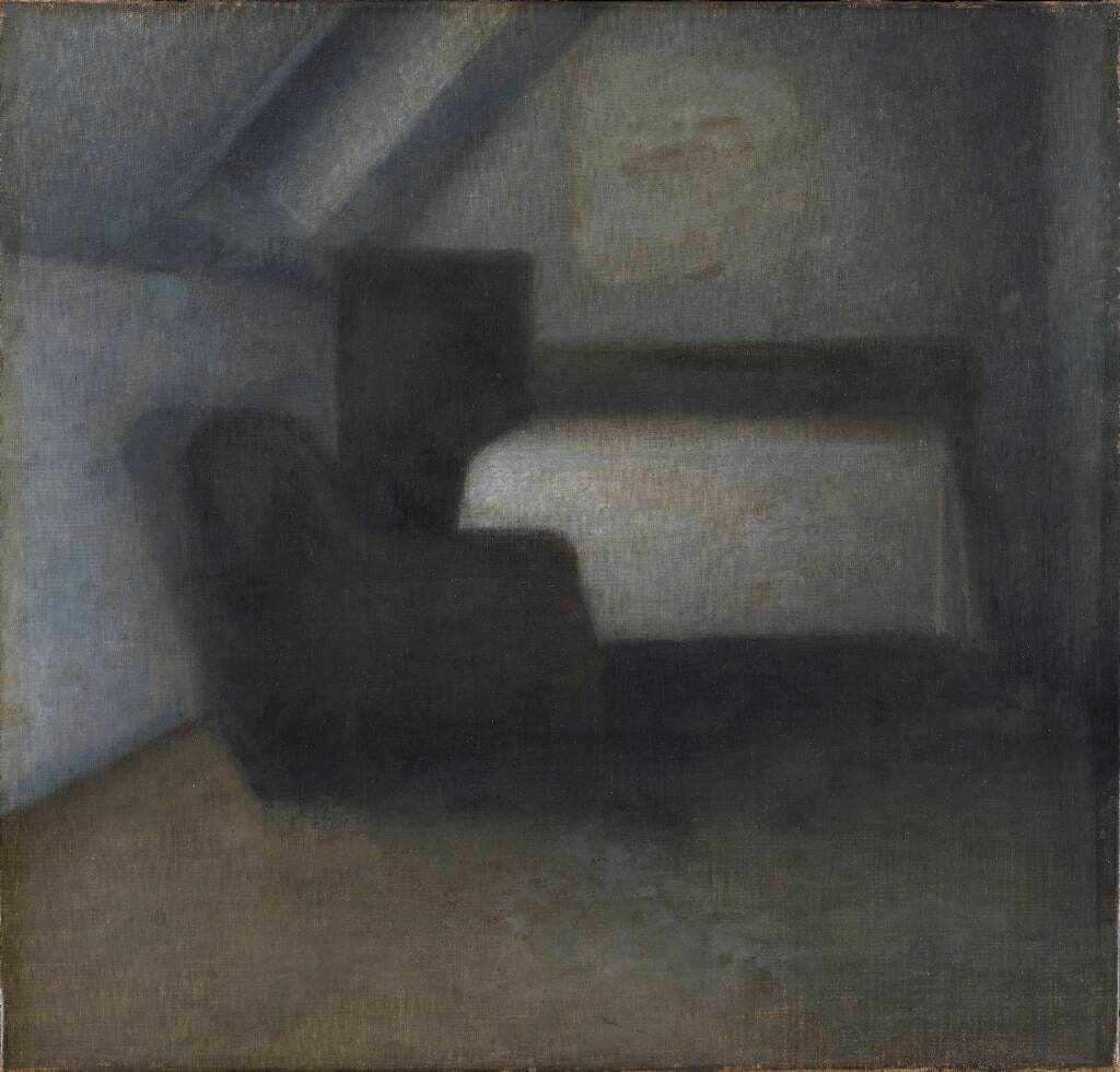 Loftværelse med bord og stol