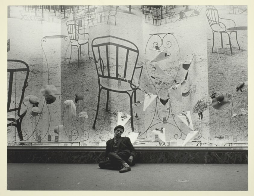 Clochard in Front of Department Store Window