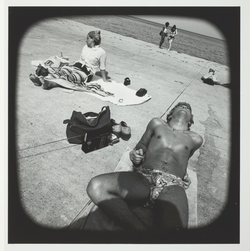 Untitled (Youth in Bathing Suit Sunning on Concrete at Lakefront), from the series "Beach"