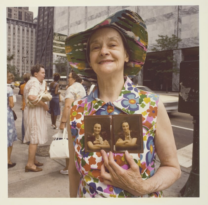 Untitled (Woman Holding Twin Photos)