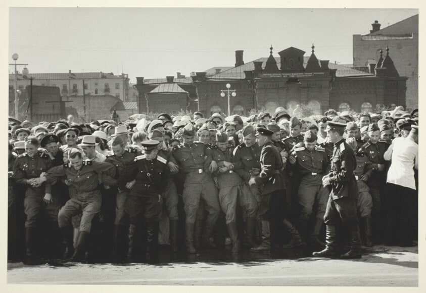 Russian Soldiers with Linked Arms Holding Back Mob