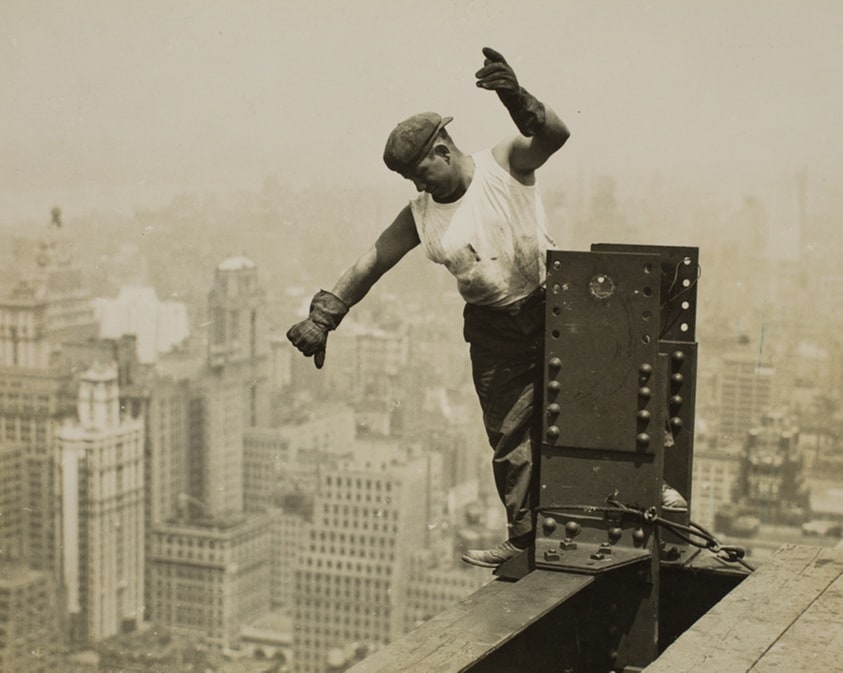 Worker Giving High-Signal to the Derrick Crew