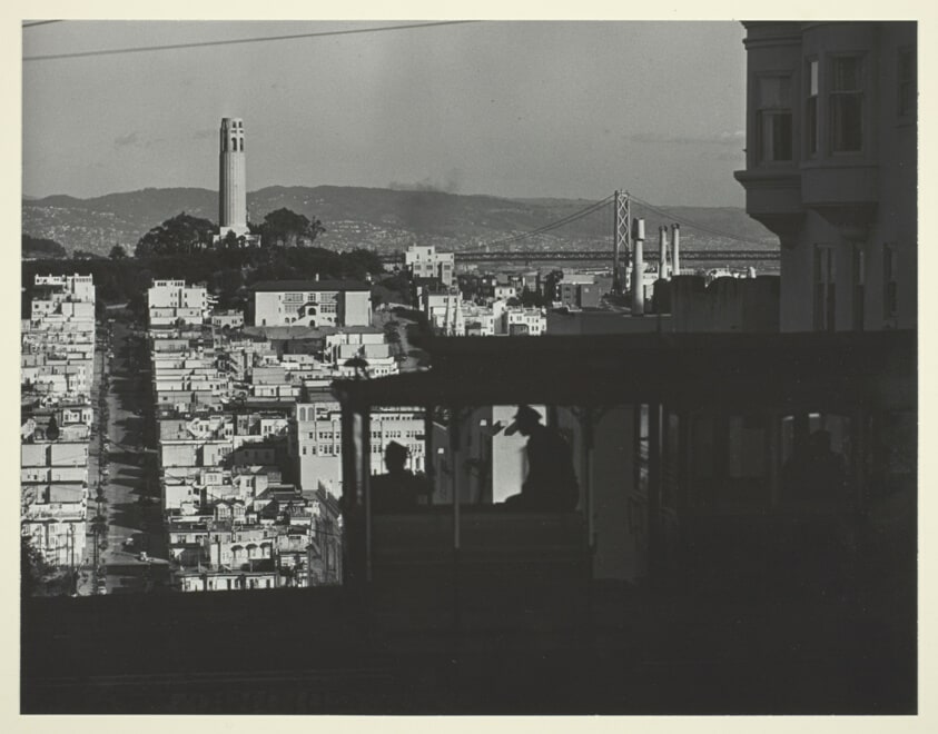 Bridges of San Francisco. Top of Hyde Street. Cable Car Passenger's View: Coit Tower and Bay Bridge