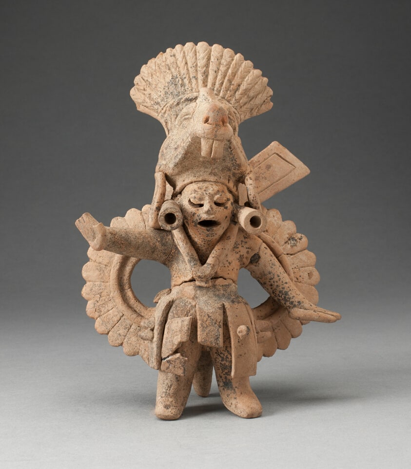 Dancing Figure Wearing Animal Headdress and Ornate Costume