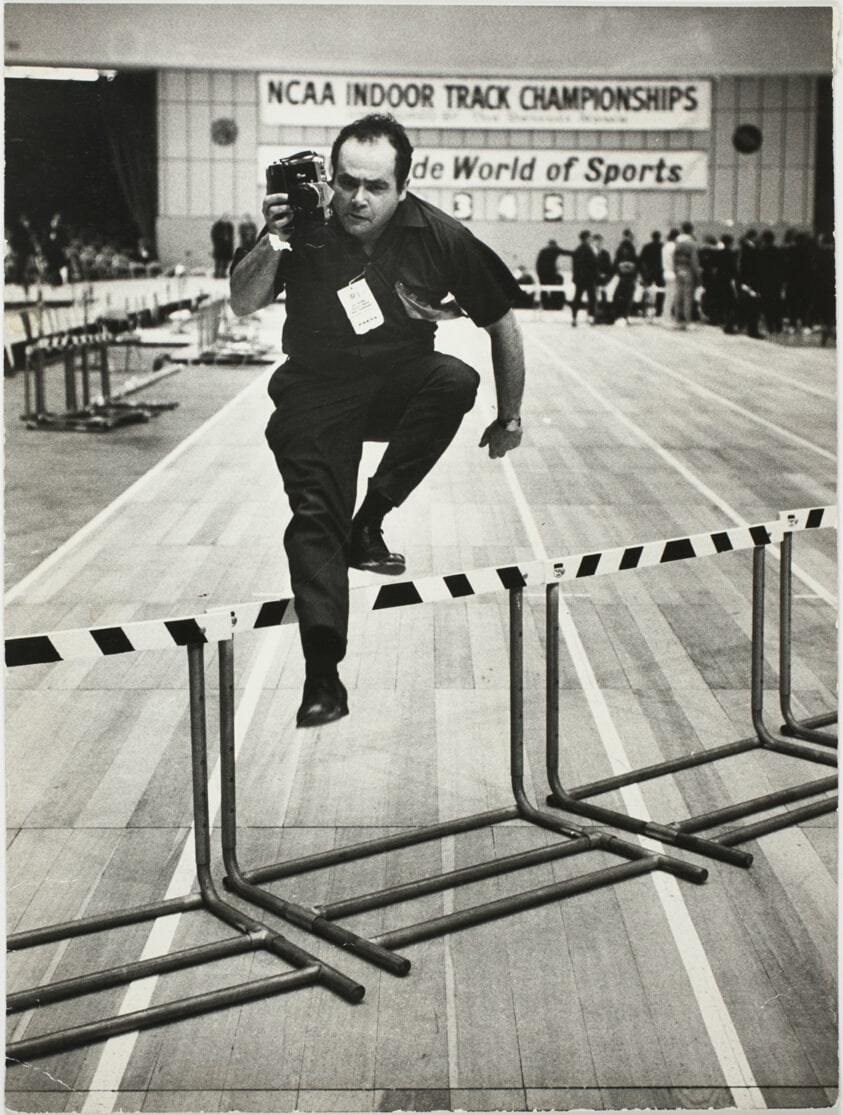 Shay Demonstrates Facetiously How He Runs Backwards and Covers Hurdlers