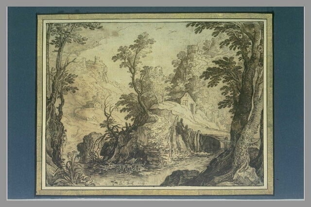 Ruisseau au fond d'une vallée avec des maisons