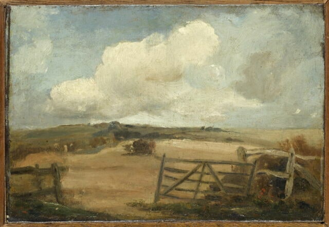 Paysage avec un champ et une barrière