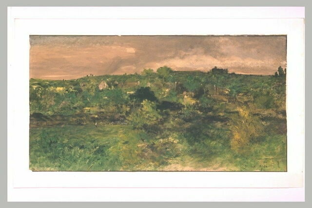 Vue d'un village parmi les arbres