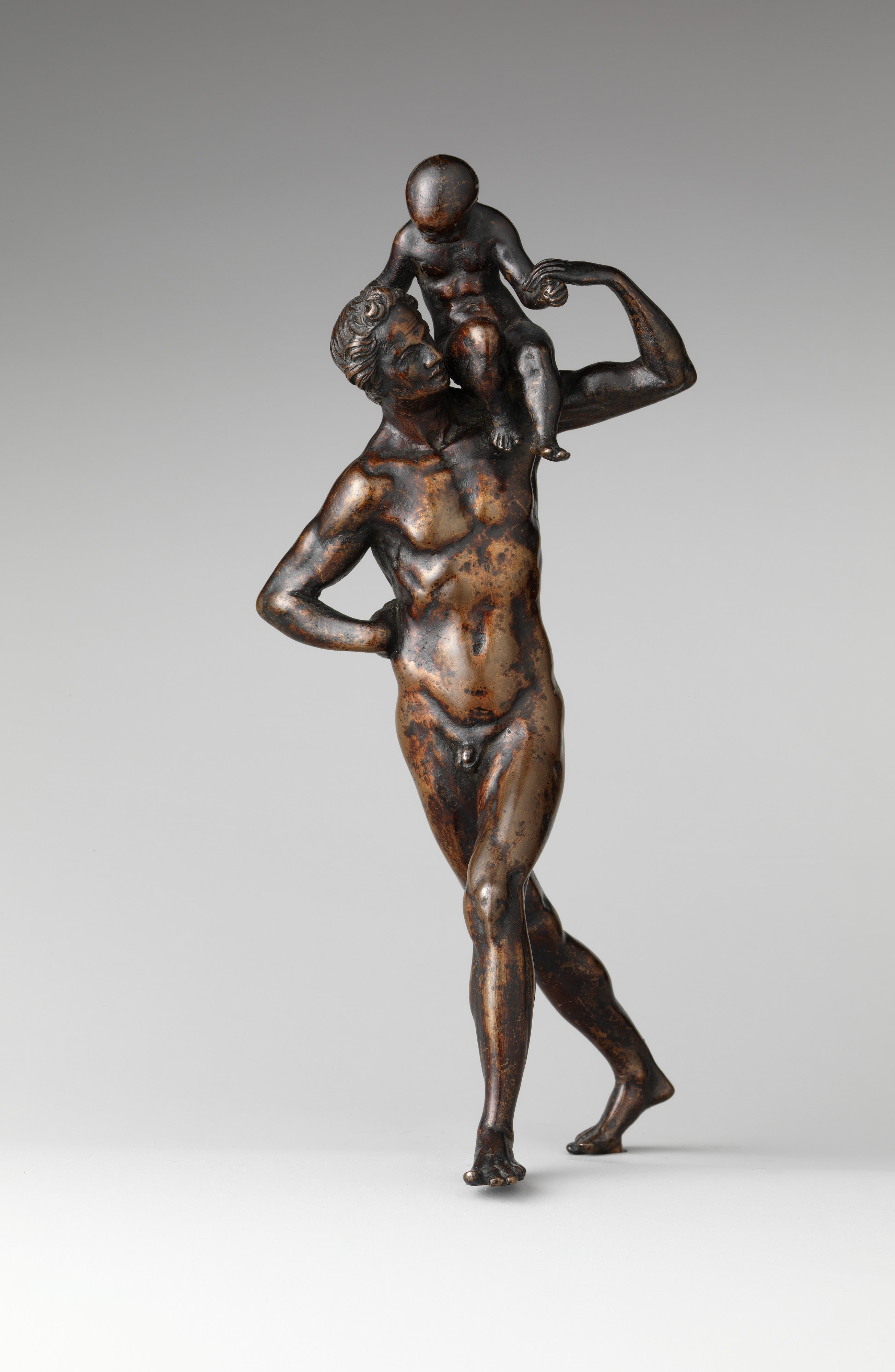 Man Carrying a Child on His Shoulder