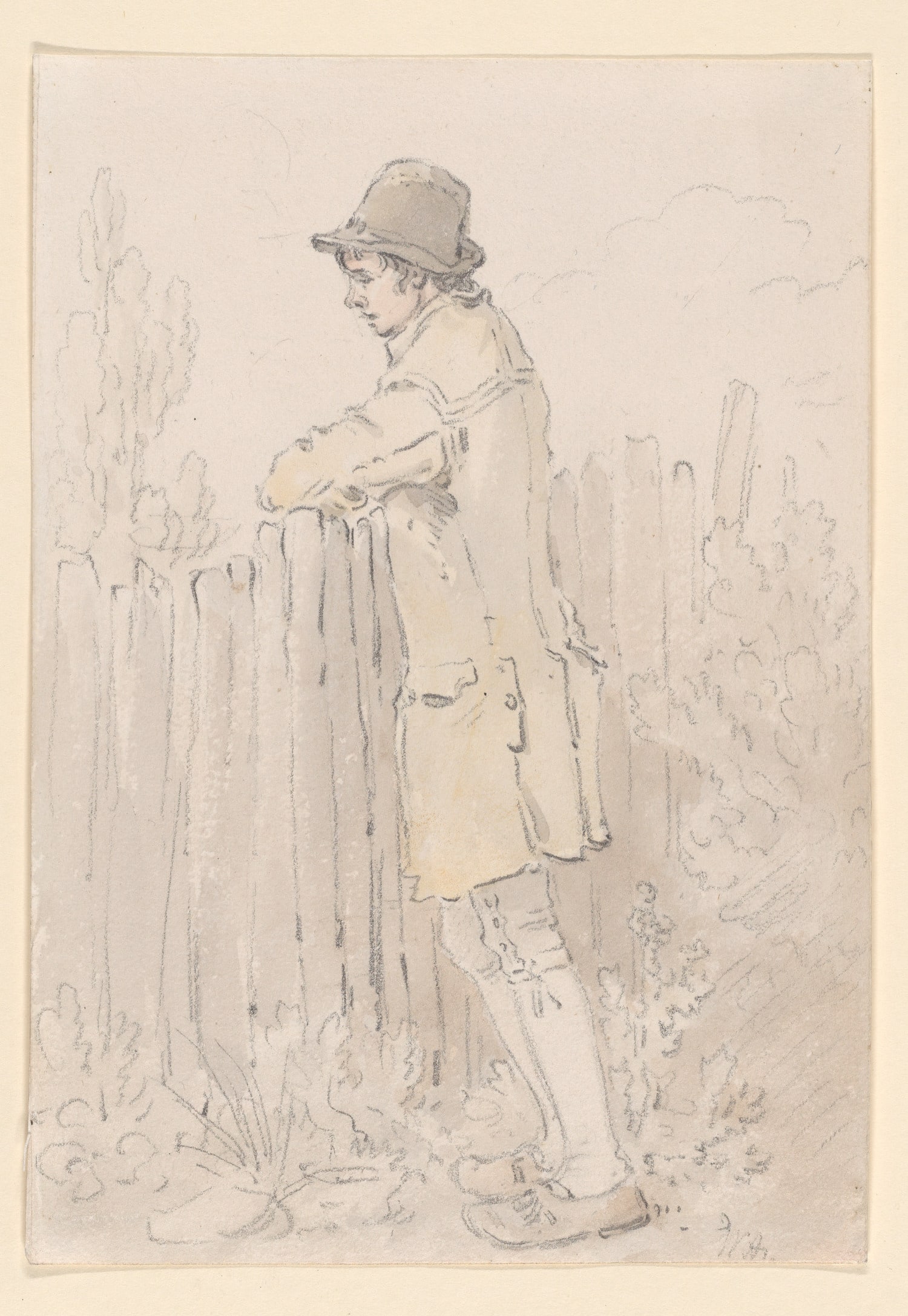 A Young Man Leaning on a Fence