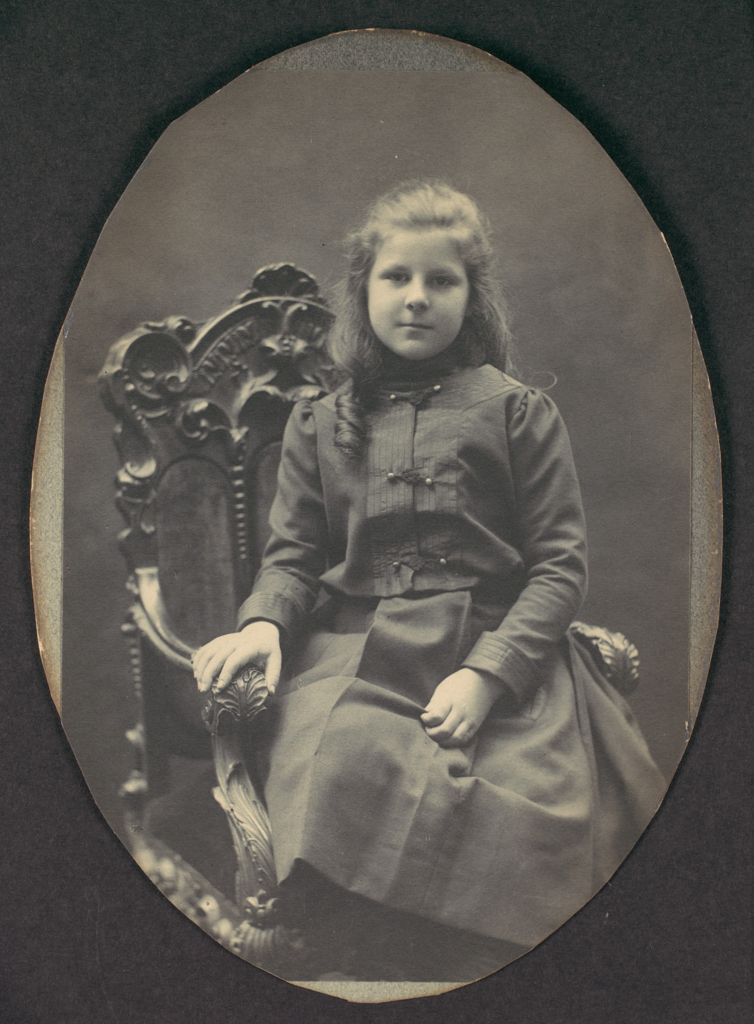 [Girl with Ringlets, Seated, Three-Quarter Length]