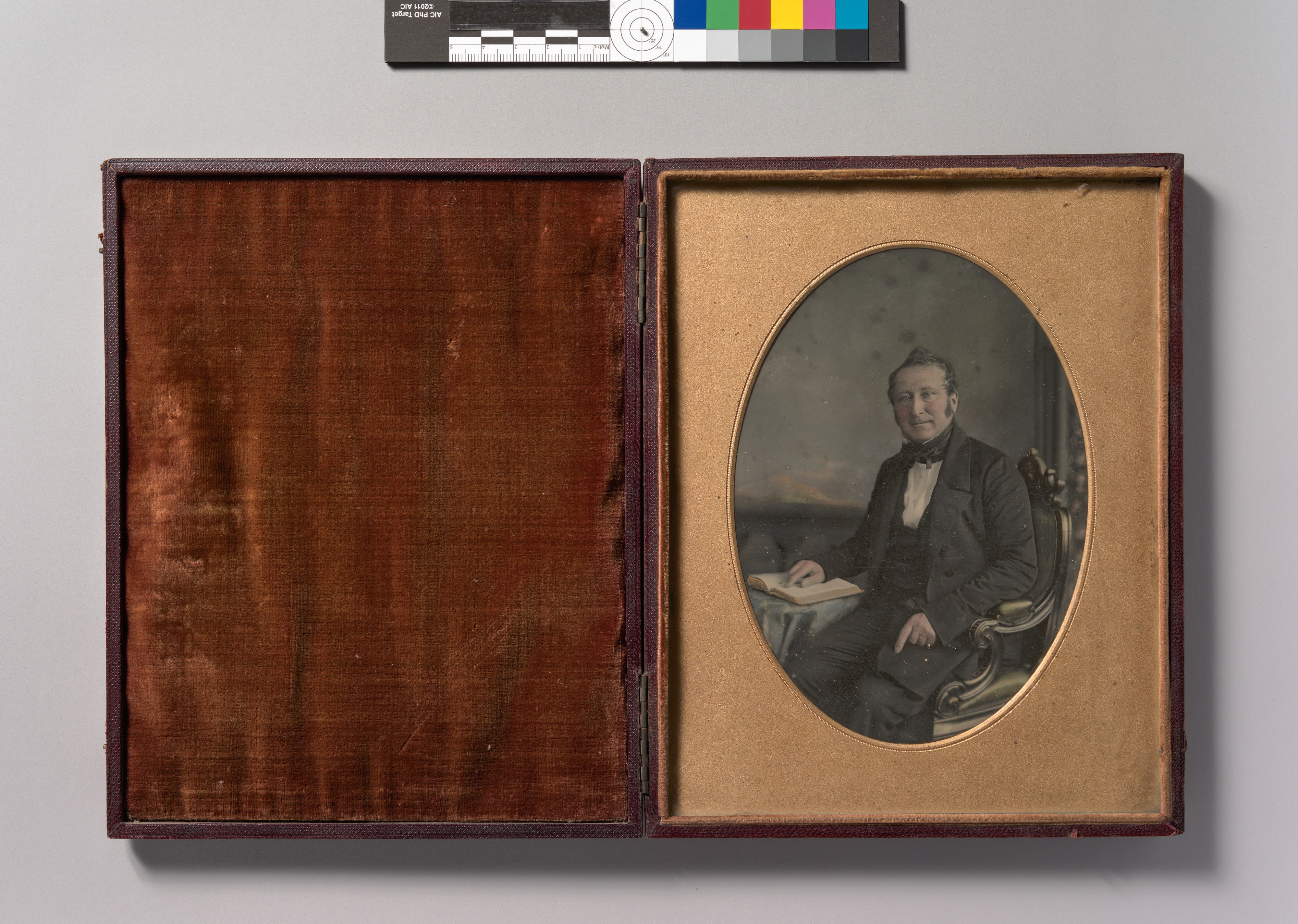 [Seated Man Pointing to a Passage in an Open Book]