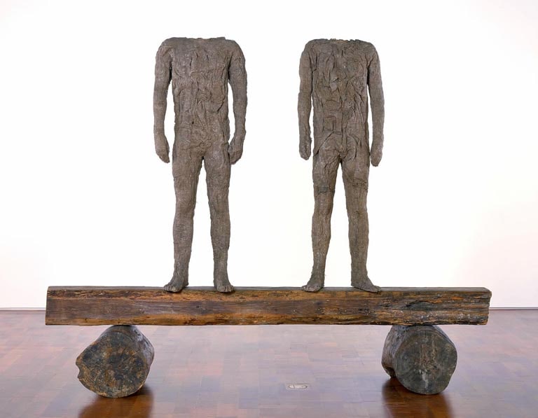 Two Figures on Beam