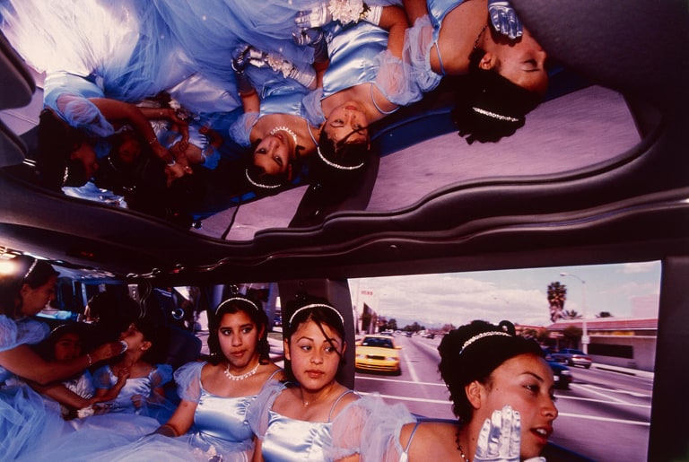 The "damas" (maids of honor) go from the church to the reception in a Ford Explorer limousine at Ruby's "quinceañera," Huntington Park, California