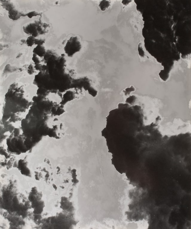Man holding large camera photographing a cataclysmic event, possibly a volcano erupting. 1908/2012 (Version XIII), from Smoke Series