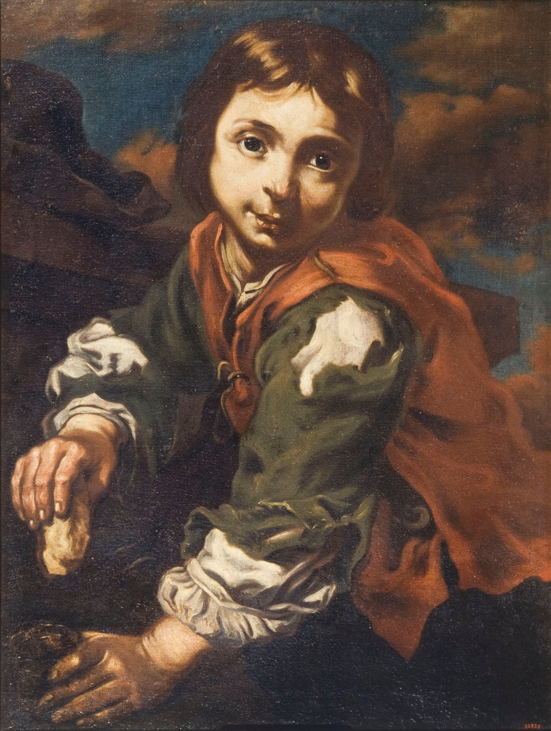 Boy dipping bread in a glass of wine